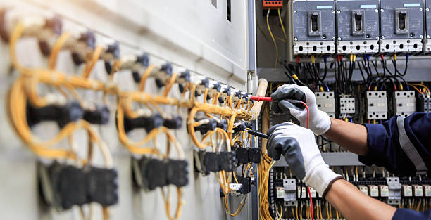 Professional Electrician technician working in Tidmore Bend, AL